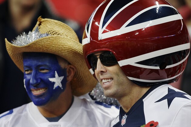 Dallas Cowboys' fans pose before the NFL football game between the Dallas Cowboys and the Jacksonville Jaguars at Wembley Stadium, London, Sunday, Nov. 9, 2014.  (AP Photo/Matt Dunham)