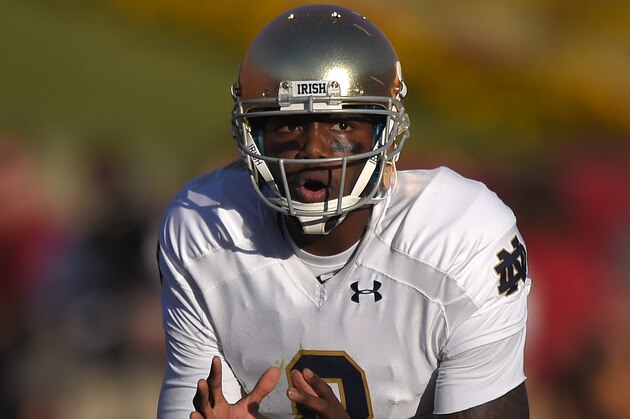 Notre Dame quarterback Malik Zaire yells to his team during the second half an NCAA college football game against Southern California, Saturday, Nov. 29, 2014, in Los Angeles. Southern California won 49-14. (AP Photo/Mark J. Terrill)