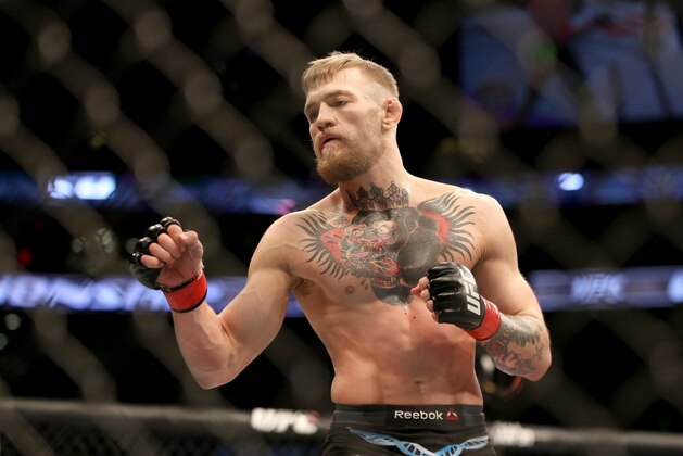 Conor McGregor in action against Denis Siver, during their featherweight fight at UFC Fight Night, Sunday, January 18, 2015 in Boston.  McGregor won via 2nd round TKO. (AP Photo/Gregory Payan)