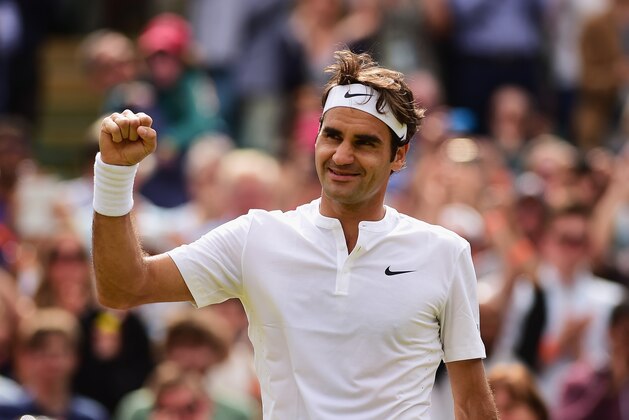 LONDON, ENGLAND - JULY 08:  Roger Federer of Switzerland celebrates winning after match point in his Gentlemens Singles Quarter Final match against Gilles Simon of France during day nine of the Wimbledon Lawn Tennis Championships at the All England Lawn Tennis and Croquet Club on July 8, 2015 in London, England.  (Photo by Shaun Botterill/Getty Images)