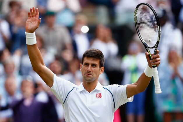 LONDON, ENGLAND - JULY 08:  Novak Djokovic of Serbia celebrates after winning his Gentlemens Singles Quarter Final match against Marin Cilic of Croatia during day nine of the Wimbledon Lawn Tennis Championships at the All England Lawn Tennis and Croquet Club on July 8, 2015 in London, England.  (Photo by Julian Finney/Getty Images)