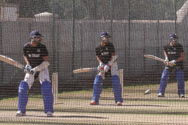 Indian cricket players take part in a practise session in Harare, Zimbabwe, Wednesday, July, 8, 2015. The Indian Cricket team is in Zimbabwe for a  tour from 10 to 19 July 2015. The tour will see them playing  three One Day International matches and two Twenty20 matches against Zimbabwe. (AP Photo/Tsvangirayi Mukwazhi)