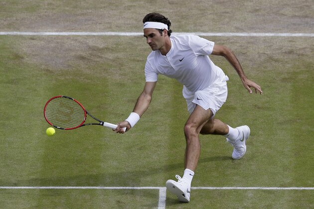 Roger Federer of Switzerland returns a shot to Gilles Simon of France during the men's quarterfinal singles match at the All England Lawn Tennis Championships in Wimbledon, London, Wednesday July 8, 2015. (AP Photo/Tim Ireland) Roger Federer of Switzerland returns a shot to Gilles Simon of France during the men's quarterfinal singles match at the All England Lawn Tennis Championships in Wimbledon, London, Wednesday July 8, 2015. (AP Photo/Tim Ireland)