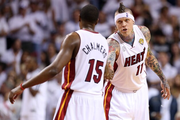 MIAMI, FL - JUNE 09:  (R-L) Chris Andersen #11 celebrates with Mario Chalmers #15 of the Miami Heat in the second half while taking on the San Antonio Spurs during Game Two of the 2013 NBA Finals at AmericanAirlines Arena on June 9, 2013 in Miami, Florida. NOTE TO USER: User expressly acknowledges and agrees that, by downloading and or using this photograph, User is consenting to the terms and conditions of the Getty Images License Agreement.  (Photo by Christian Petersen/Getty Images)