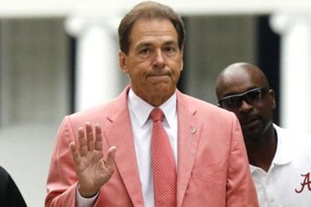 Alabama head coach Nick Saban waves to fans during a ceremony for former captains before Alabama's spring NCAA college football game, Saturday, April 18, 2015, in Tuscaloosa, Ala. (AP Photo/Butch Dill)