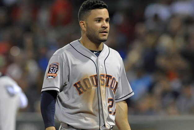 Jul 3, 2015; Boston, MA, USA; Houston Astros second baseman Jose Altuve (27) walks to the dugout after scoring a run during the tenth inning against the Boston Red Sox at Fenway Park. Mandatory Credit: Bob DeChiara-USA TODAY Sports