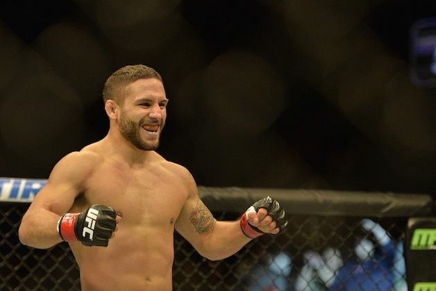 Apr 4, 2015; Fairfax, VA, USA; Chad Mendes (red gloves) celebrates after the first round of technical knock out against Richardo Lamas (not pictured) during UFC Fight Night at Patriot Center. Mandatory Credit: Tommy Gilligan-USA TODAY Sports
