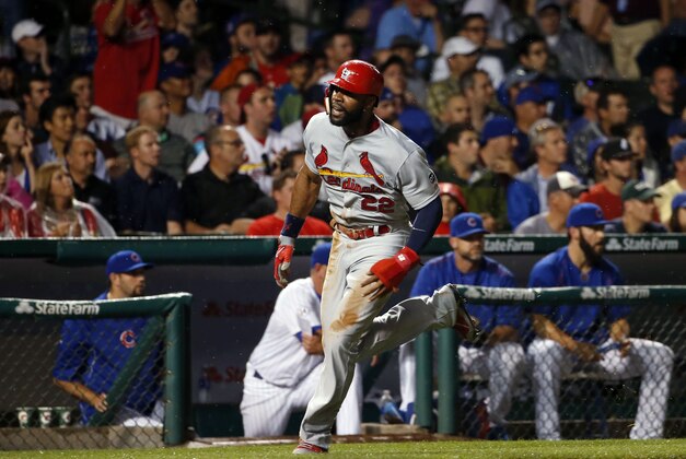 Jul 6, 2015; Chicago, IL, USA; St. Louis Cardinals right fielder Jason Heyward (22) runs towards the home plate against the Chicago Cubs during the seventh inning at Wrigley Field. Mandatory Credit: Kamil Krzaczynski-USA TODAY Sports