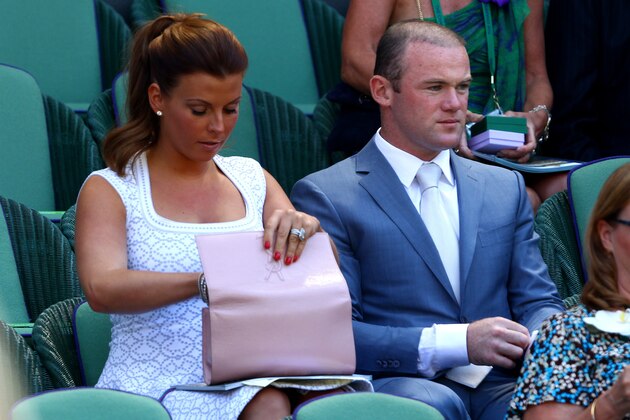 LONDON, ENGLAND - JULY 07:  Wayne Rooney and Coleen Rooney attend the Gentlemen's Singles Final match between Andy Murray of Great Britain and Novak Djokovic of Serbia on day thirteen of the Wimbledon Lawn Tennis Championships at the All England Lawn Tennis and Croquet Club on July 7, 2013 in London, England.  (Photo by Clive Brunskill/Getty Images)