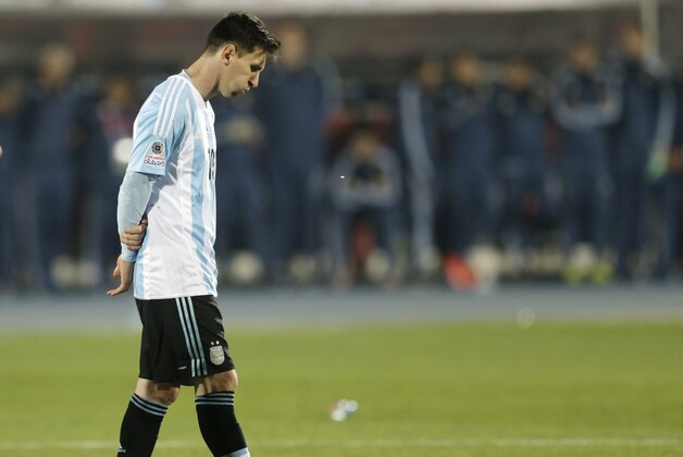Argentina's Lionel Messi reacts after Argentina's Gonzalo Higuain missed his penalty kick against Chile  during the Copa America final soccer match at the National Stadium in Santiago, Chile, Saturday, July 4, 2015. (AP Photo/Ricardo Mazalan)