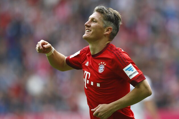 Bayern's Bastian Schweinsteiger celebrates after scoring his side's second goal during the German first division Bundesliga soccer match between FC Bayern Munich and 1. FSV Mainz 05 at the Allianz Arena in Munich, Germany, on Saturday, May 23, 2015. (AP Photo/Matthias Schrader)