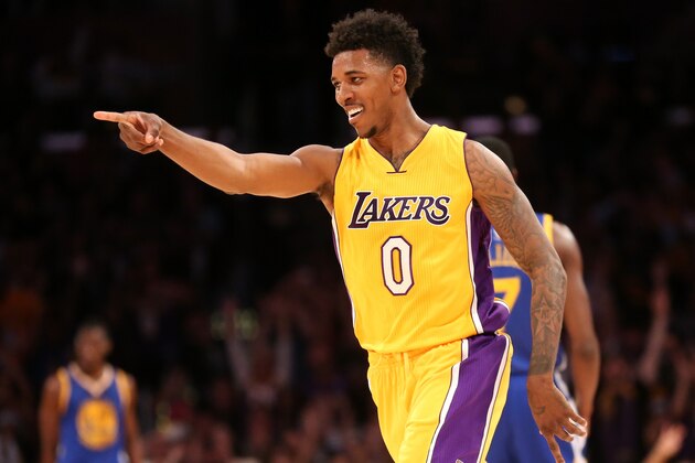 LOS ANGELES, CA - DECEMBER 23: Nick Young #0 of the Los Angeles Lakers points to a teammate after making a three point shot against the Golden State Warriors at Staples Center on December 23, 2014 in Los Angeles, California. NOTE TO USER: User expressly acknowledges and agrees that, by downloading and or using this photograph, User is consenting to the terms and conditions of the Getty Images License Agreement. (Photo by Stephen Dunn/Getty Images) LOS ANGELES, CA - DECEMBER 23: Nick Young #0 of the Los Angeles Lakers points to a teammate after making a three point shot against the Golden State Warriors at Staples Center on December 23, 2014 in Los Angeles, California. NOTE TO USER: User expressly acknowledges and agrees that, by downloading and or using this photograph, User is consenting to the terms and conditions of the Getty Images License Agreement. (Photo by Stephen Dunn/Getty Images)