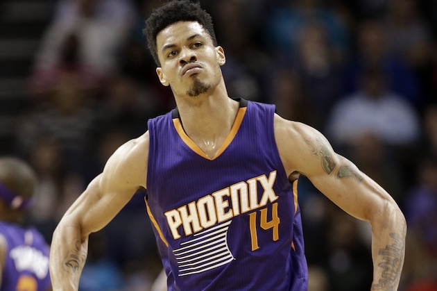 Phoenix Suns' Gerald Green reacts after making a 3-point basket against the Charlotte Hornets during the first half of an NBA basketball game in Charlotte, N.C., Wednesday, Dec. 17, 2014. (AP Photo/Chuck Burton)