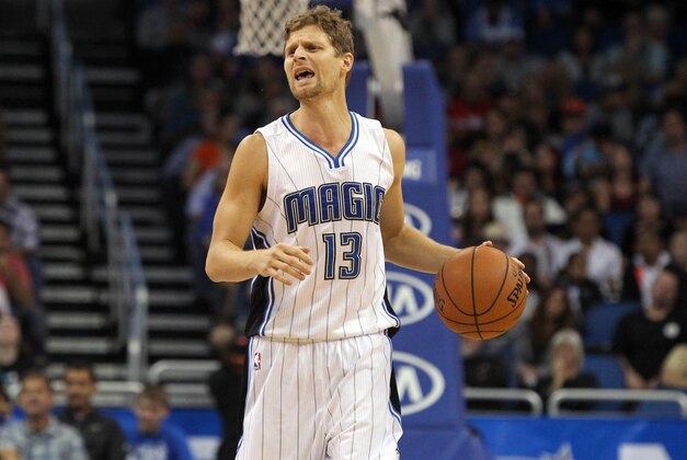 Dec 30, 2014; Orlando, FL, USA; Orlando Magic guard Luke Ridnour (13) calls a play as he dribbles the ball against the Detroit Pistons during the second half at Amway Center. Detroit Pistons defeated the Orlando Magic 109-86. Mandatory Credit: Kim Klement-USA TODAY Sports