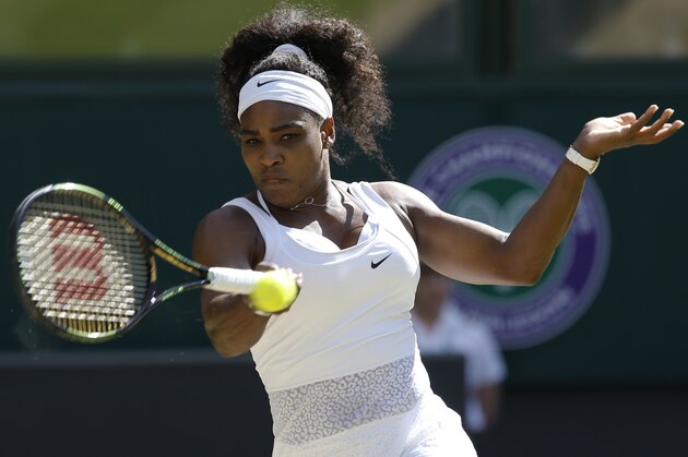 Serena Williams of the United States returns a shot to Maria Sharapova of Russia, during the women's singles semifinal match at the All England Lawn Tennis Championships in Wimbledon, London, Thursday July 9, 2015. (AP Photo/Alastair Grant)