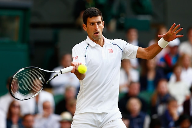 LONDON, ENGLAND - JULY 08:  Novak Djokovic of Serbia plays a forehand in his Gentlemens Singles Quarter Final match against Marin Cilic of Croatia during day nine of the Wimbledon Lawn Tennis Championships at the All England Lawn Tennis and Croquet Club on July 8, 2015 in London, England.  (Photo by Julian Finney/Getty Images)