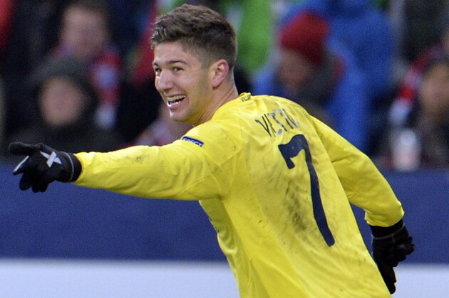 Villareal's Luciano Vietto celebrates after scoring during the Europa League Round 32 soccer match between FC Salzburg and Villareal FC in the Arena in Salzburg, Austria, Thursday, Feb. 26, 2015. (AP Photo/Kerstin Joensson)