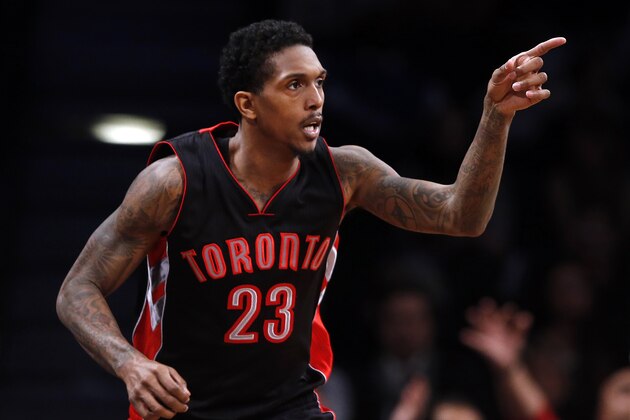 Toronto Raptors' Lou Williams (23) reacts after scoring against the Brooklyn Nets during overtime of an NBA basketball game Friday, Jan. 30, 2015, in New York.Toronto defeated Brooklyn 127-122 in overtime. (AP Photo/Jason DeCrow)