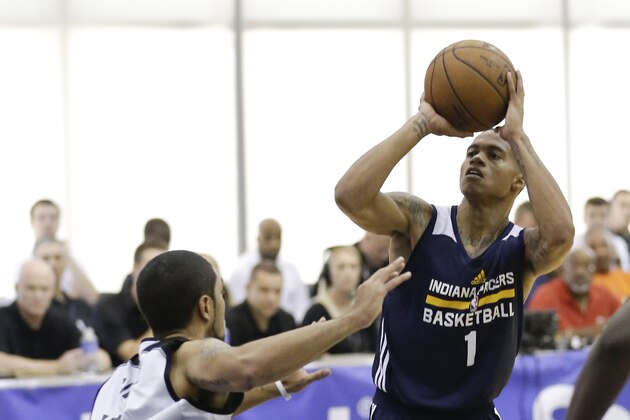Indiana Pacers' Joe Young (1) takes a shot over Orlando Magic Blue's Peyton Siva, left, during the first half of an NBA summer league basketball game, Thursday, July 9, 2015, in Orlando, Fla. (AP Photo/John Raoux)