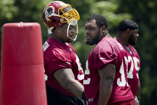 Washington Redskins Terrance Knighton (98) and Chris Baker (92) take part in drills during NFL football minicamp at Redskins Park Tuesday, June 16, 2015 in Ashburn, Va. (AP Photo/Pablo Martinez Monsivais)