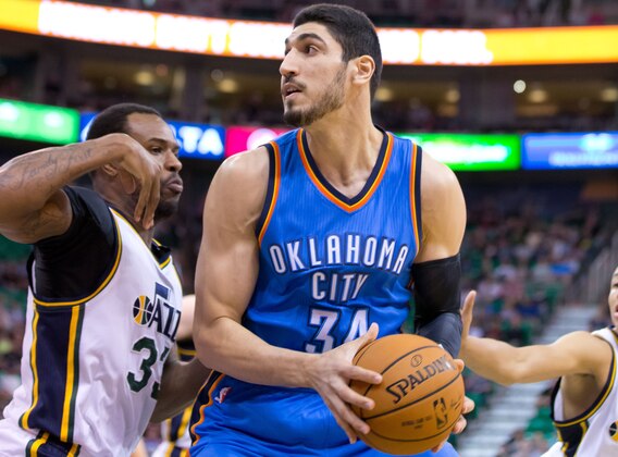 Mar 28, 2015; Salt Lake City, UT, USA; Utah Jazz forward Trevor Booker (33) defends against Oklahoma City Thunder center Enes Kanter (34) during the first quarter at EnergySolutions Arena. Mandatory Credit: Russ Isabella-USA TODAY Sports