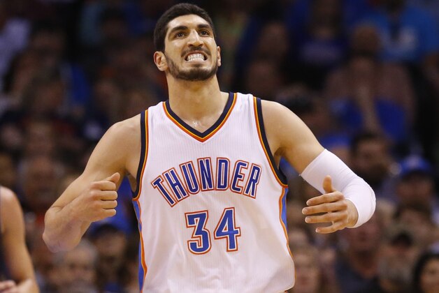 Oklahoma City Thunder center Enes Kanter (34) reacts after being fouled in the first quarter of an NBA basketball game against the Dallas Mavericks in Oklahoma City, Wednesday, April 1, 2015. (AP Photo/Sue Ogrocki)