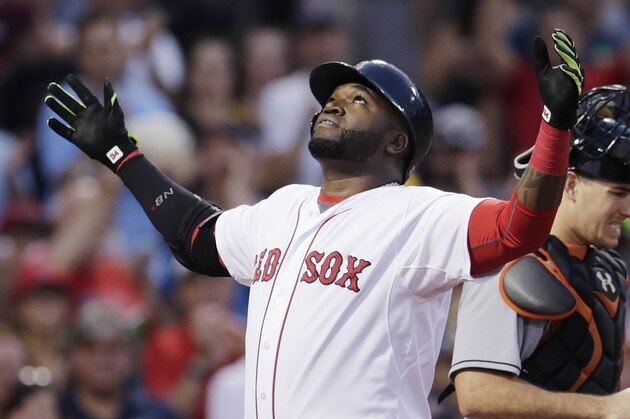 Boston Red Sox's David Ortiz reacts as he crosses home plate after his two-run home run during the third inning a baseball game at Fenway Park, Wednesday July 8, 2015, in Boston. At right is Miami Marlins catcher J.T. Realmuto. (AP Photo/Charles Krupa)