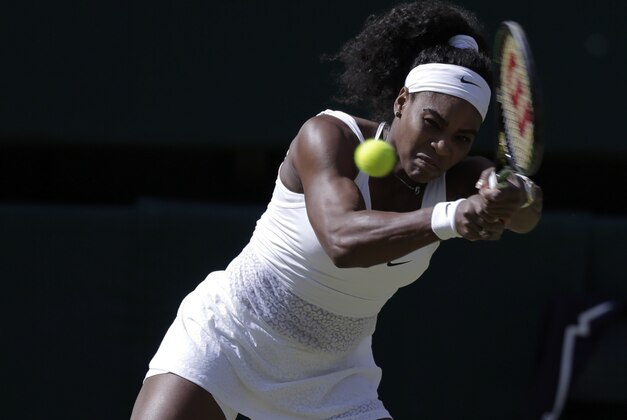 Serena Williams of the United States returns a shot to Maria Sharapova of Russia during the women's singles semifinal match at the All England Lawn Tennis Championships in Wimbledon, London, Thursday July 9, 2015. (AP Photo/Pavel Golovkin)