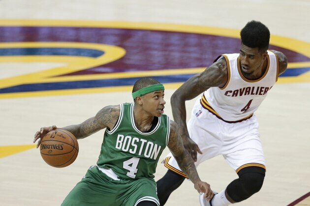 Boston Celtics’ Isaiah Thomas, left, drives past Cleveland Cavaliers'  Iman Shumpert during a first-round NBA playoff basketball game Tuesday, April 21, 2015, in Cleveland. (AP Photo/Tony Dejak)