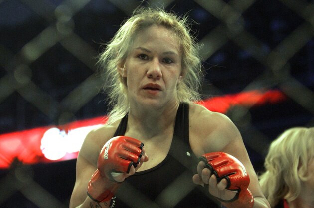 Cristiane Santos celebrates her win over Hitomi Akano during their fight in a Strikeforce mixed martial arts event on Saturday, April 11, 2009, in San Jose, Calif. Santos won by TKO in round 3. (AP Photo/Jeff Chiu)