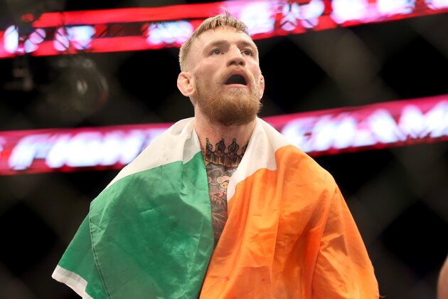 Conor McGregor, of Ireland, celebrates a win against Denis Siver, of Germany, after their featherweight fight at UFC Fight Night, Sunday, Jan. 18, 2015 in Boston.  McGregor won via 2nd round TKO. (AP Photo/Gregory Payan)
