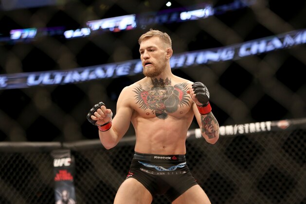 Conor McGregor in action against Denis Siver, during their featherweight fight at UFC Fight Night, Sunday, January 18, 2015 in Boston.  McGregor won via 2nd round TKO. (AP Photo/Gregory Payan)