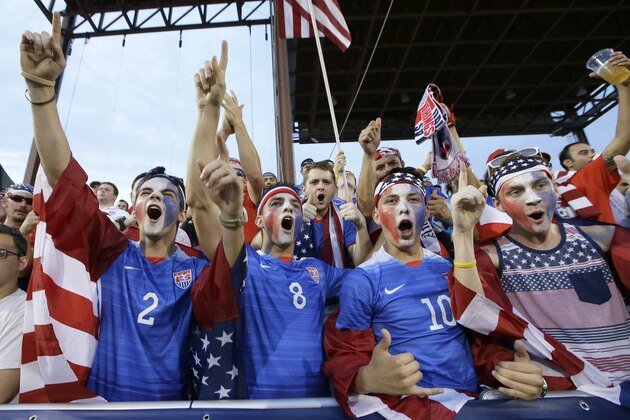 U.S. soccer fans cheer during the first half of a CONCACAF Gold Cup soccer match in Frisco, Texas, Tuesday, July 7, 2015. (AP Photo/LM Otero)