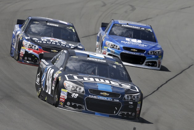 Jimmie Johnson (48) leads Dale Earnhardt Jr. (88) and Kasey Kahne (5) through Turn 3 during a NASCAR Sprint Cup Series auto race at Pocono Raceway in Long Pond, Pa., Sunday, June 7, 2015. (AP Photo/Mel Evans) Jimmie Johnson (48) leads Dale Earnhardt Jr. (88) and Kasey Kahne (5) through Turn 3 during a NASCAR Sprint Cup Series auto race at Pocono Raceway in Long Pond, Pa., Sunday, June 7, 2015. (AP Photo/Mel Evans)