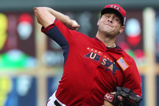 United States' pitcher Lucas Giolito throws a pitch during the fifth inning of the All-Star Futures baseball game against the World Team, Sunday, July 13, 2014, in Minneapolis. (AP Photo/Jim Mone)