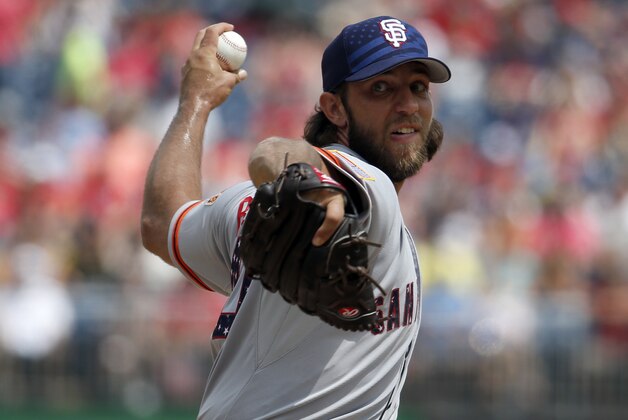 San Francisco Giants starting pitcher Madison Bumgarner (40) throws during the  first inning of a baseball game against the Washington Nationals at Nationals Park, Saturday, July 4, 2015, in Washington. (AP Photo/Alex Brandon)