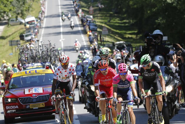 The breakaway group with Eritrea's Daniel Teklehaimanot, wearing the best climber's dotted jersey, Luis Angel Mate Mardones of Spain, Brice Feillu of France, Croatia's Kristijan Durasek and Anthony Delaplace of France, from left to right, climb during the seventh stage of the Tour de France cycling race over 190.5 kilometers (118.4 miles) with start in Livarot and finish in Fougeres, France, Friday, July 10, 2015. (AP Photo/Laurent Cipriani)
