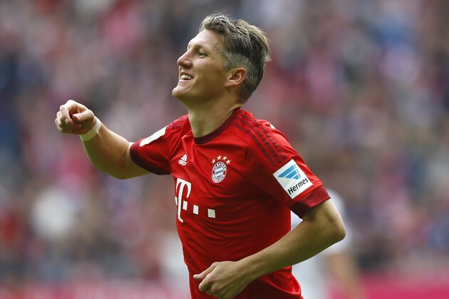 Bayern's Bastian Schweinsteiger celebrates after scoring his side's second goal during the German first division Bundesliga soccer match between FC Bayern Munich and 1. FSV Mainz 05 at the Allianz Arena in Munich, Germany, on Saturday, May 23, 2015. (AP Photo/Matthias Schrader)