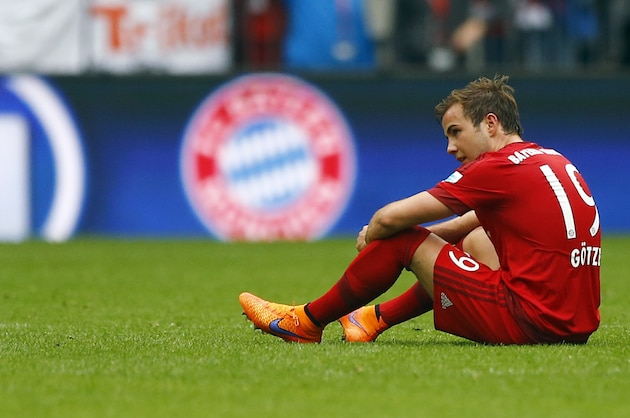 Bayern's Mario Goetze sits on the ground after the German first division Bundesliga soccer match between FC Bayern Munich and FC Augsburg at the Allianz Arena in Munich, Germany, on Saturday, May 9, 2015. (AP Photo/Matthias Schrader)