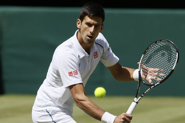Novak Djokovic of Serbia returns a shot to Richard Gasquet of France during the men's singles semifinal match at the All England Lawn Tennis Championships in Wimbledon, London, Friday July 10, 2015. (AP Photo/Kirsty Wigglesworth)