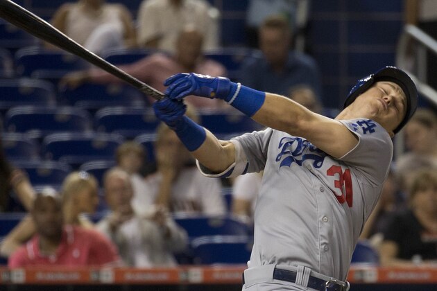 Los Angeles Dodgers' Joc Pederson (31) strikes at a ball thrown by Miami Marlins starting pitcher Justin Nicolino during the first inning of a baseball game in Miami, Friday, June 26, 2015. (AP Photo/J Pat Carter)
