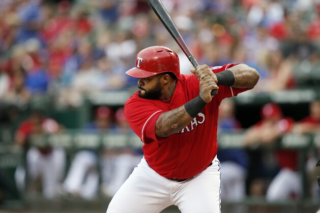 Texas Rangers' Prince Fielder stands at the play as he looks for a pitch from Arizona Diamondbacks' Robbie Ray in the first inning of an interleague baseball game Tuesday, July 7, 2015, in Arlington, Texas. (AP Photo/Tony Gutierrez)