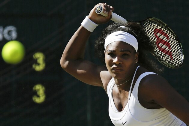 Serena Williams of the United States returns a shot to Maria Sharapova of Russia, during the women's singles semifinal match at the All England Lawn Tennis Championships in Wimbledon, London, Thursday July 9, 2015. (AP Photo/Pavel Golovkin)