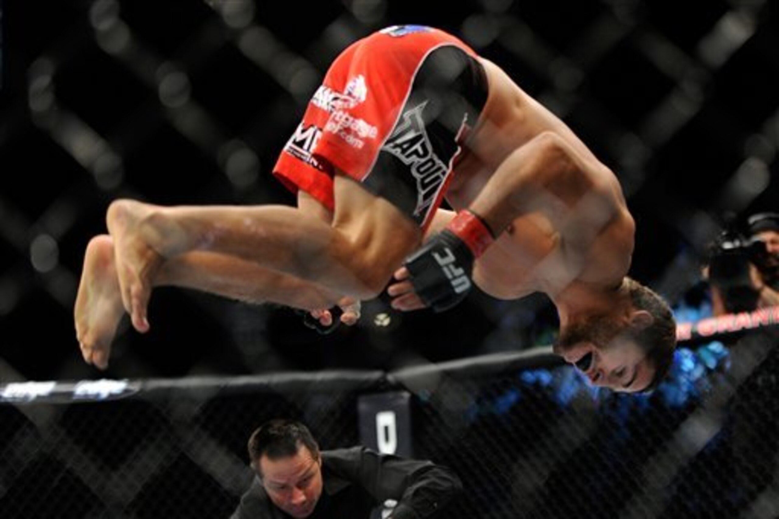 Chad Mendes, does a flip after winning his fight against Cody McKenzie by TKO during the first round of their UFC 148 featherweight bout at the MGM Grand Garden Arena, Saturday, July 7, 2012, in Las  Vegas. (AP Photo/David Becker)