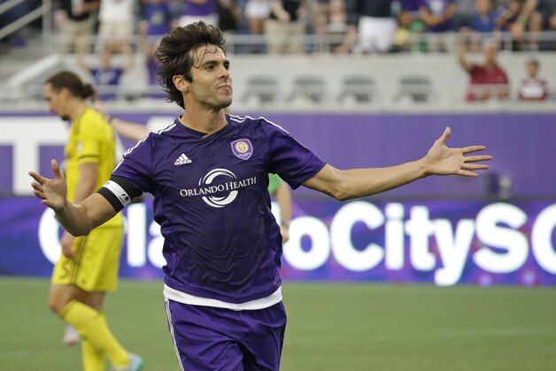 Orlando City midfielder Kaka, left, celebrates after scoring a goal against the Columbus Crew during the first half of an MLS soccer game, Tuesday, June 30, 2015, in Orlando, Fla. (AP Photo/John Raoux)