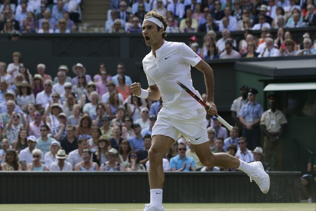 Roger Federer of Switzerland celebrates winning the 1st set against Andy Murray of Britain in their men's singles semifinal match at the All England Lawn Tennis Championships in Wimbledon, London, Friday July 10, 2015. (AP Photo/Pavel Golovkin)