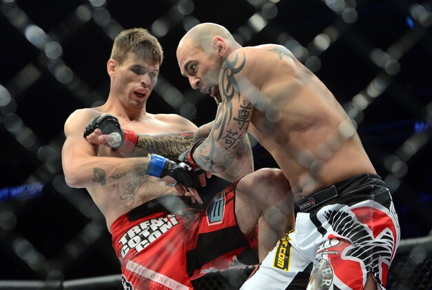 Apr 18, 2015; Newark, NJ, USA; George Sullivan (red gloves) and Tim Means (blue gloves) fight during UFC Fight Night at Prudential Center. Means won via third round tap out. Mandatory Credit: Joe Camporeale-USA TODAY Sports Apr 18, 2015; Newark, NJ, USA; George Sullivan (red gloves) and Tim Means (blue gloves) fight during UFC Fight Night at Prudential Center. Means won via third round tap out. Mandatory Credit: Joe Camporeale-USA TODAY Sports