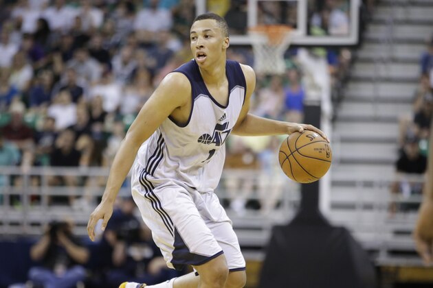 Utah Jazz's Dante Exum brings the ball up court during the second half of an NBA summer league basketball game against the Boston Celtics Monday, July 6, 2015, in Salt Lake City. (AP Photo/Rick Bowmer)