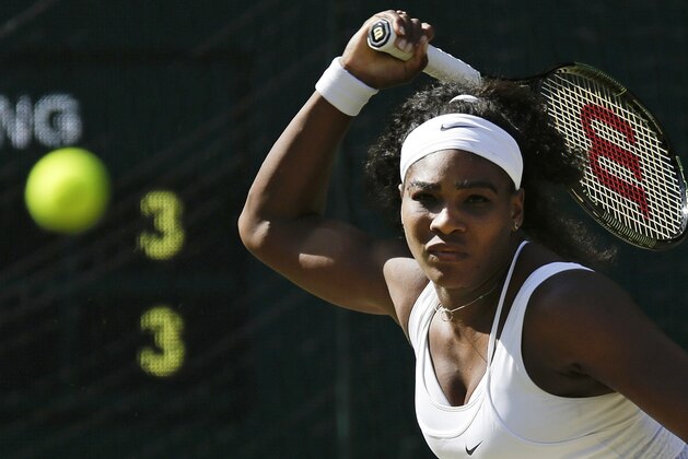 Serena Williams of the United States returns a shot to Maria Sharapova of Russia, during the women's singles semifinal match at the All England Lawn Tennis Championships in Wimbledon, London, Thursday July 9, 2015. (AP Photo/Pavel Golovkin)