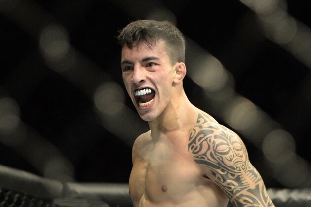 Apr 25, 2015; Montreal, Quebec, CAN; Thomas Almeida (blue) reacts after his fight against Yves Jabouin (red) (not pictured) during their bantamweight bout during UFC 186 at Bell Centre. Mandatory Credit: Eric Bolte-USA TODAY Sports